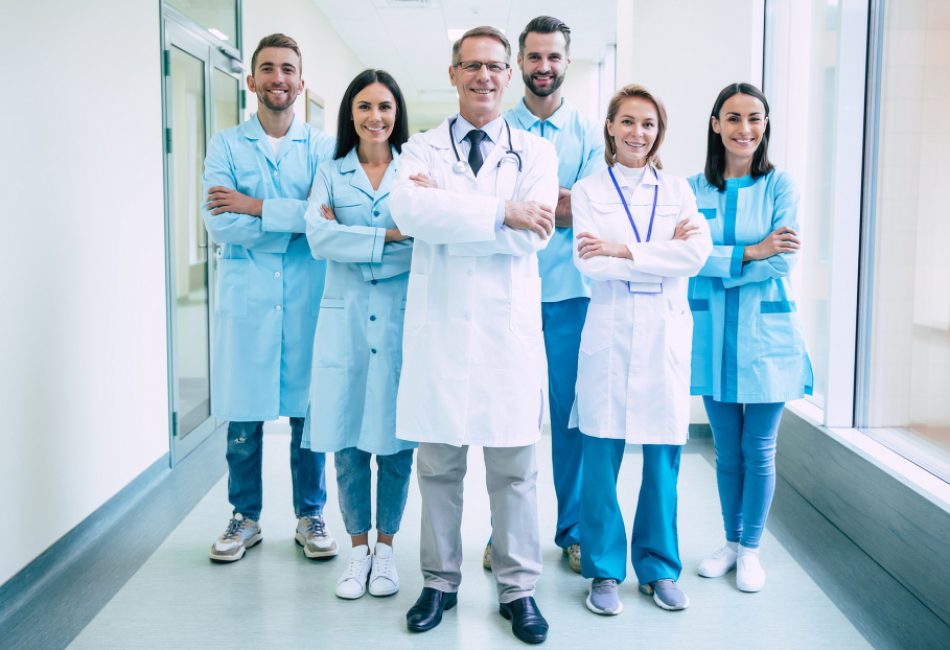 group-successful-confident-modern-medical-doctors-are-posing-looking-camera-hospital-corridor